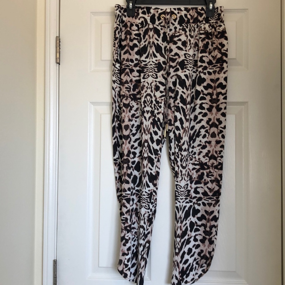 Bebe black lion print loose flowy pants.
